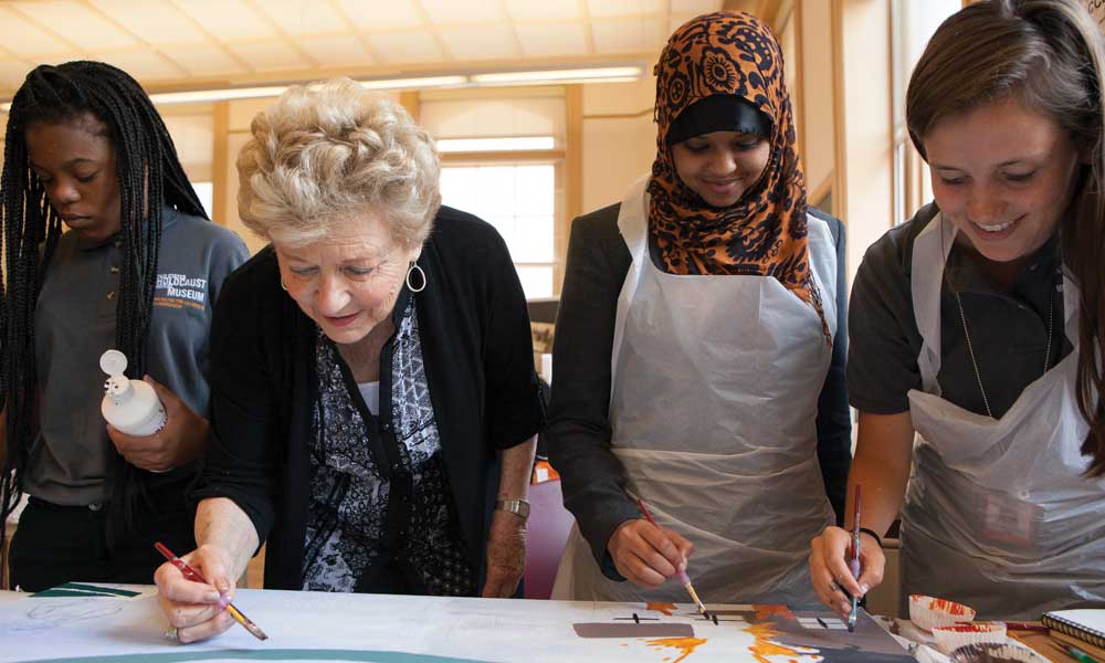 Holocaust survivor Halina Litman Yasharoff Peabody, a volunteer at the USHMM, works with students participating in the museum’s Art & Memory program. Holocaust education in action.