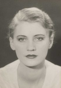White woman against a black screen