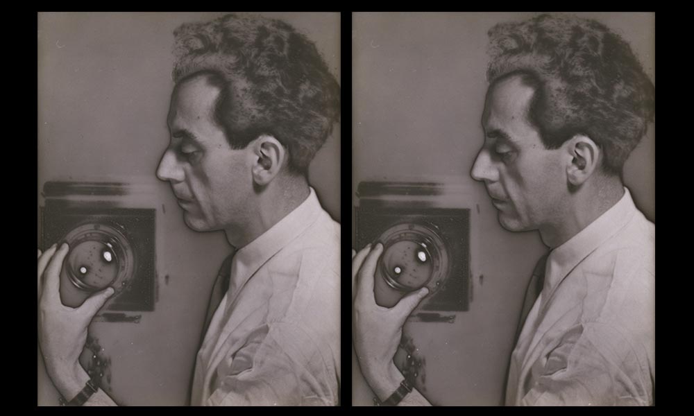 Two side by side self portraits of Man Ray in profile, intently adjusting the focal range on his view camera as if for a portrait session. He directs the camera in the photograph at the audience, while the camera taking his picture remains invisible.