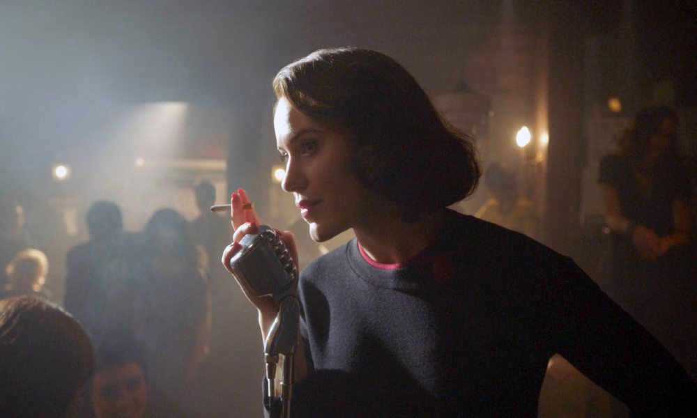 Mrs. Maisel Season 4 still: Midge at the mike