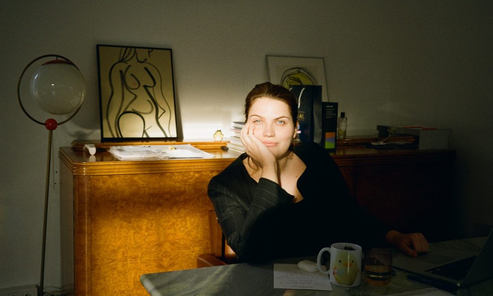 Kate Zubarieva sits in her apartment