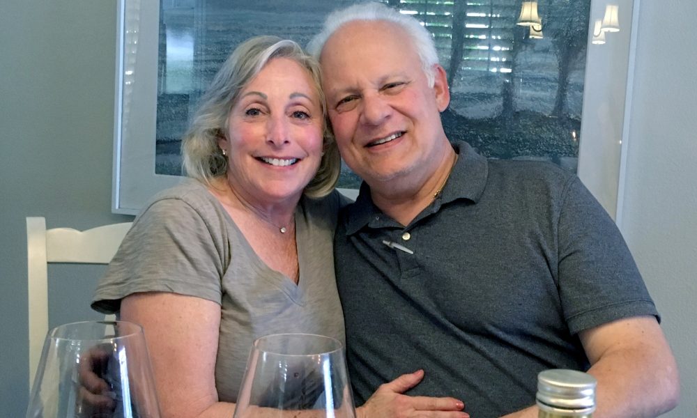 Stuart Sorkin and Joan Serot Sorkin smile together in love