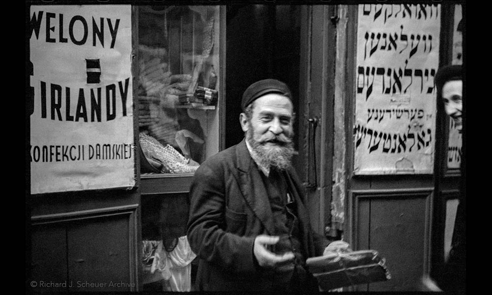 A photo of a man outside a women's apparel store in Warsaw