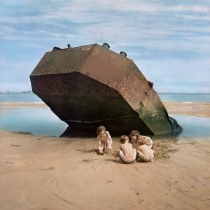 Children play among the wreckage of D-Day Invasion