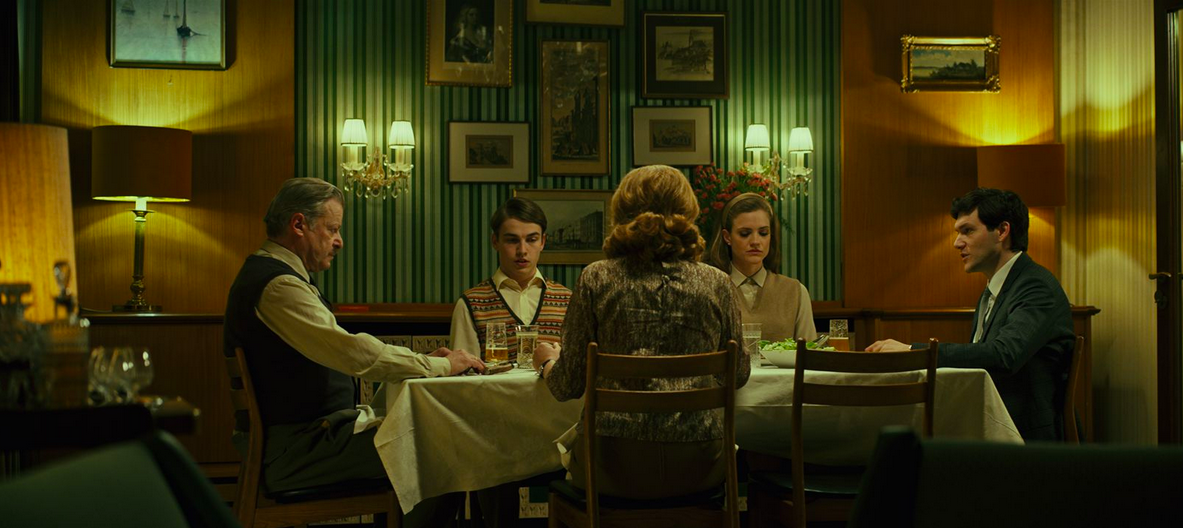 People having an orderly dinner in a dining room