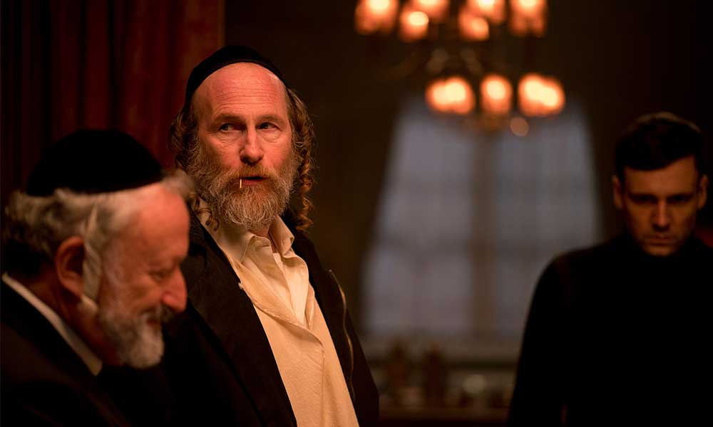 Hasidic Jews in a room with ominous lighting