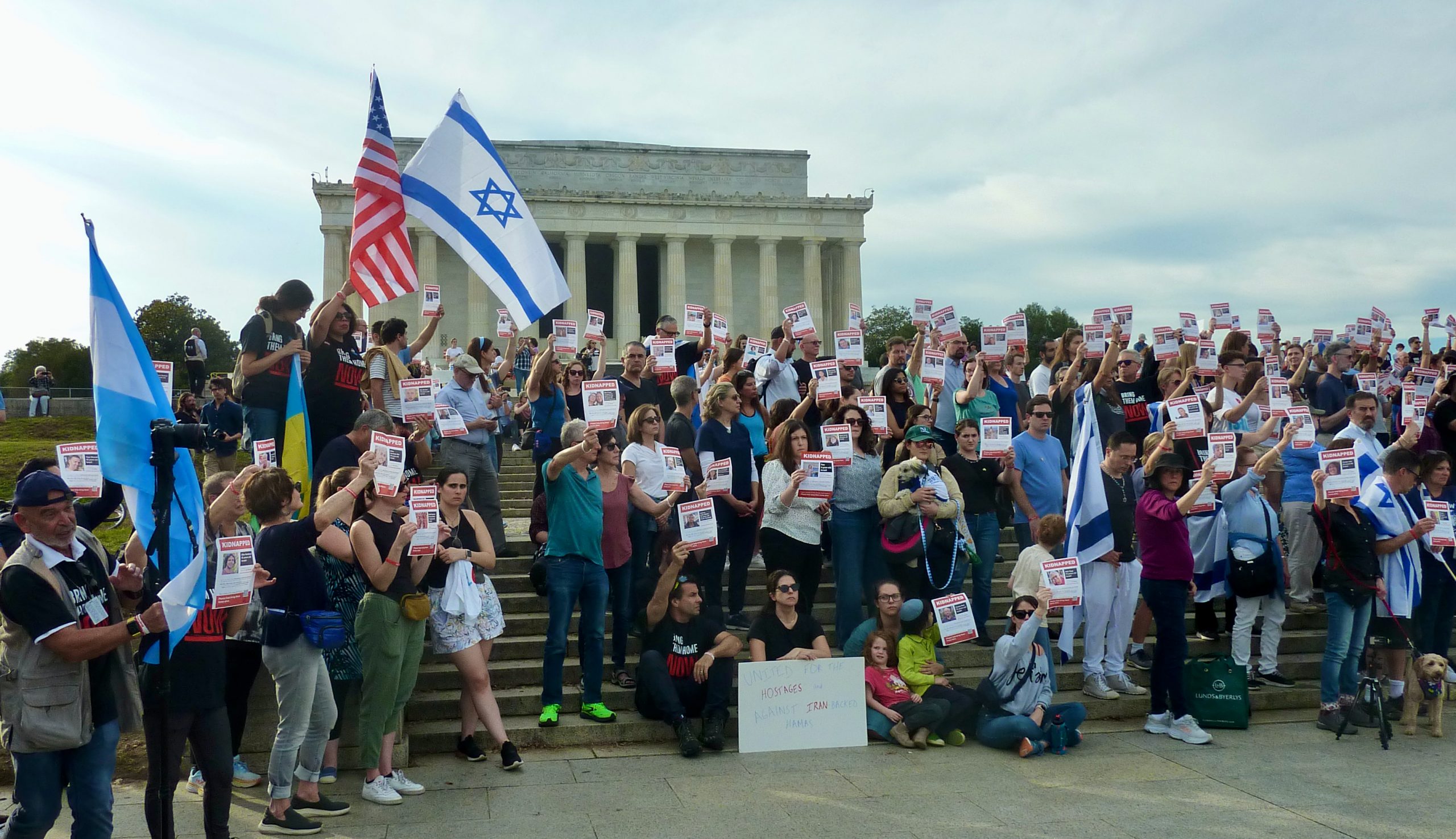 Crowd holding flyers