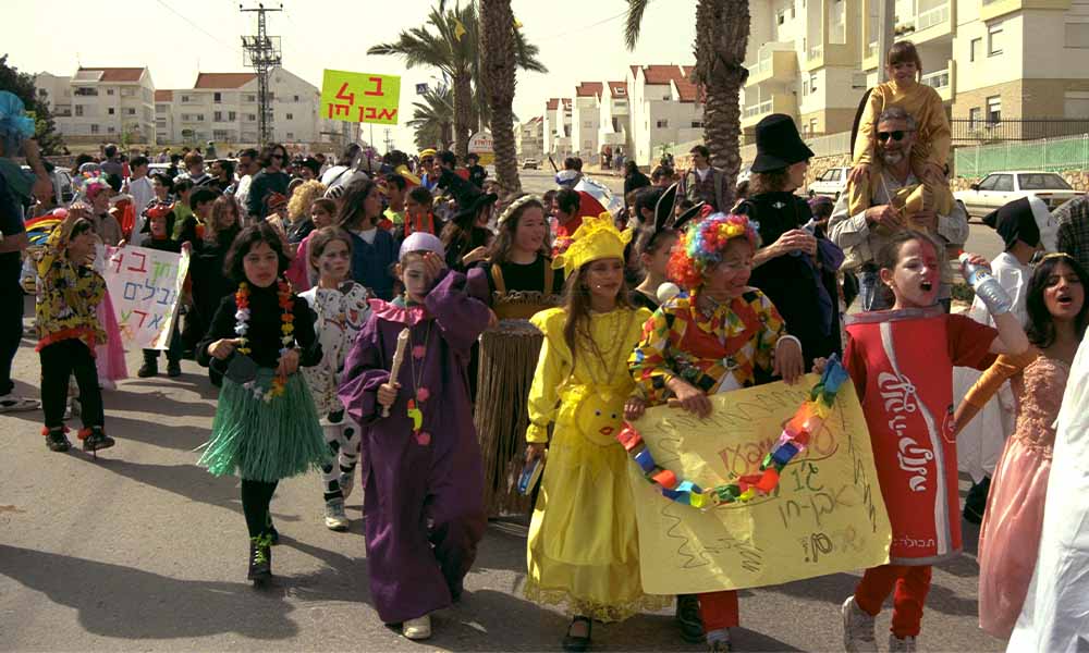 purim-costumes Children in a parade wearing Purim costumes
