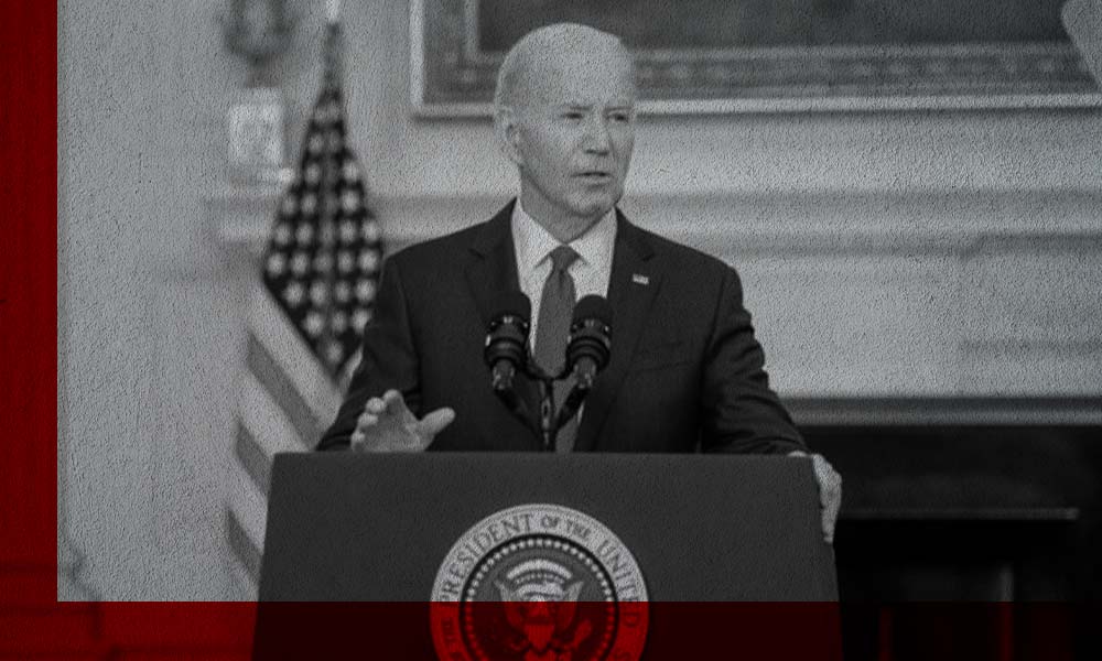 President Joe Biden stands at a podium