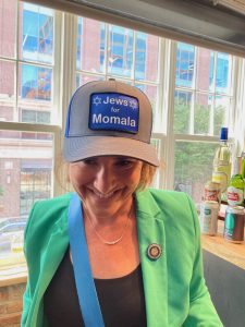Woman wearing "Jews for Momala" hat