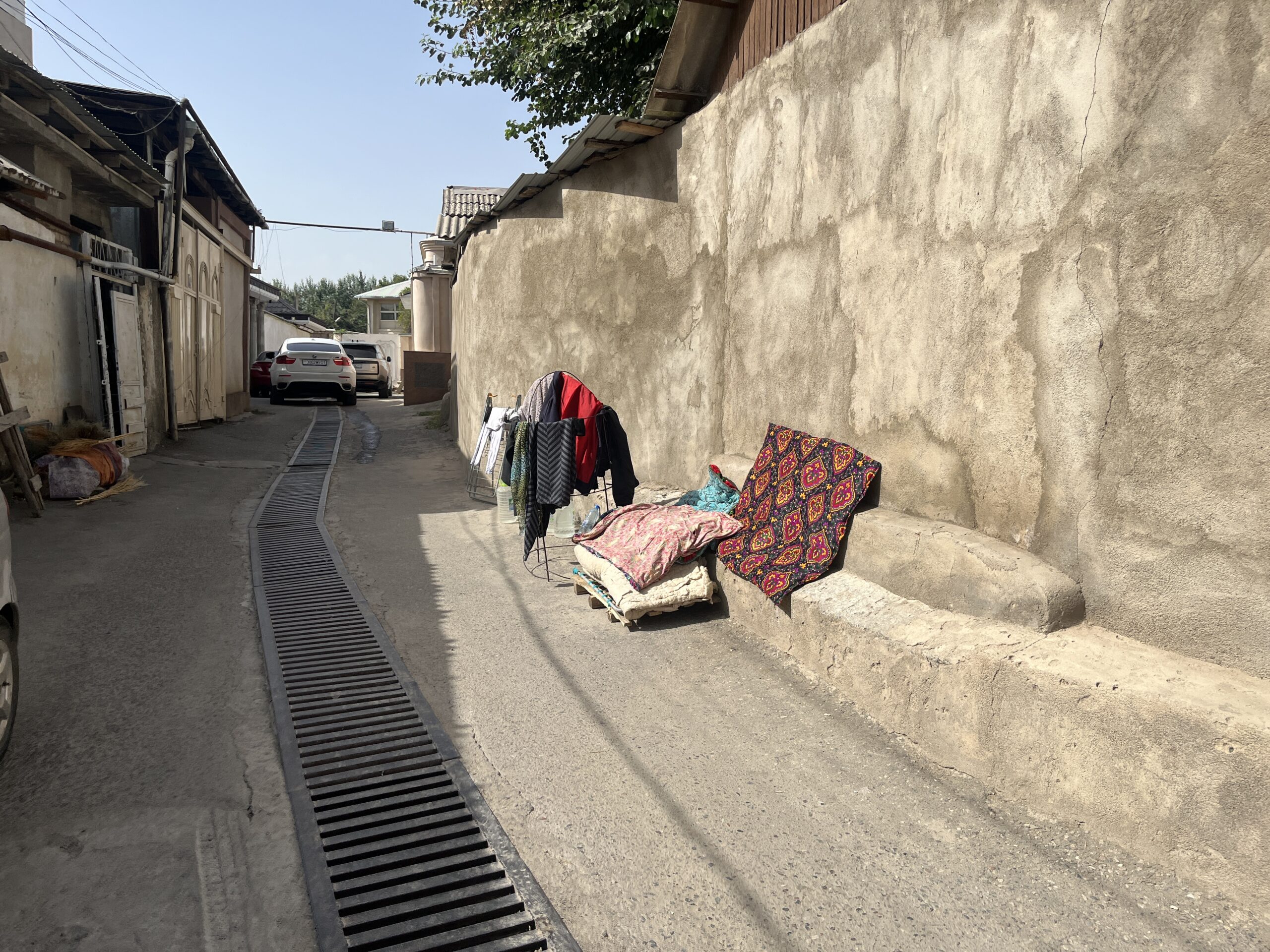 Clothes hang to dry in the alleyway outside of the synagogue.